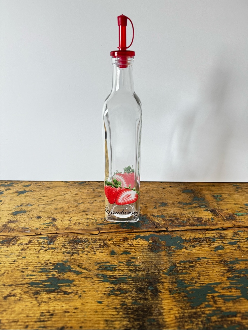 Clear Glass Strawberry Oil Bottle with Red Pour Spout